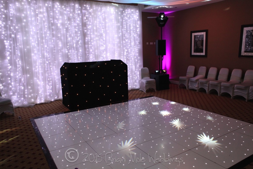 Black starlit booth, white starlit dance floor and backdrop