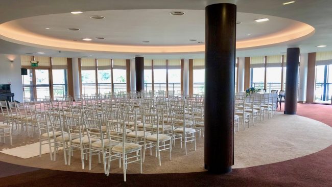 Indoor wedding ceremony at East Sussex National Hotel and Resort