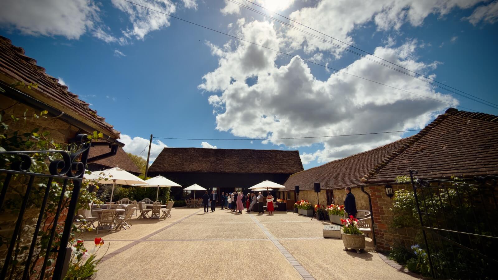 Ellie-May & Dan - Fitzleroi Barn courtyard in the sunshine, 18th April 2026