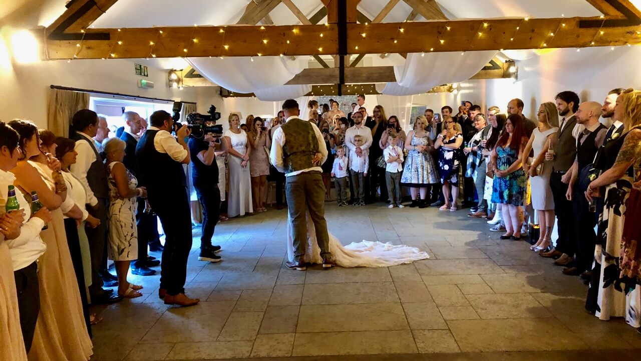 Ben and Kelly dancing with all their guests watching, Farbridge Barn