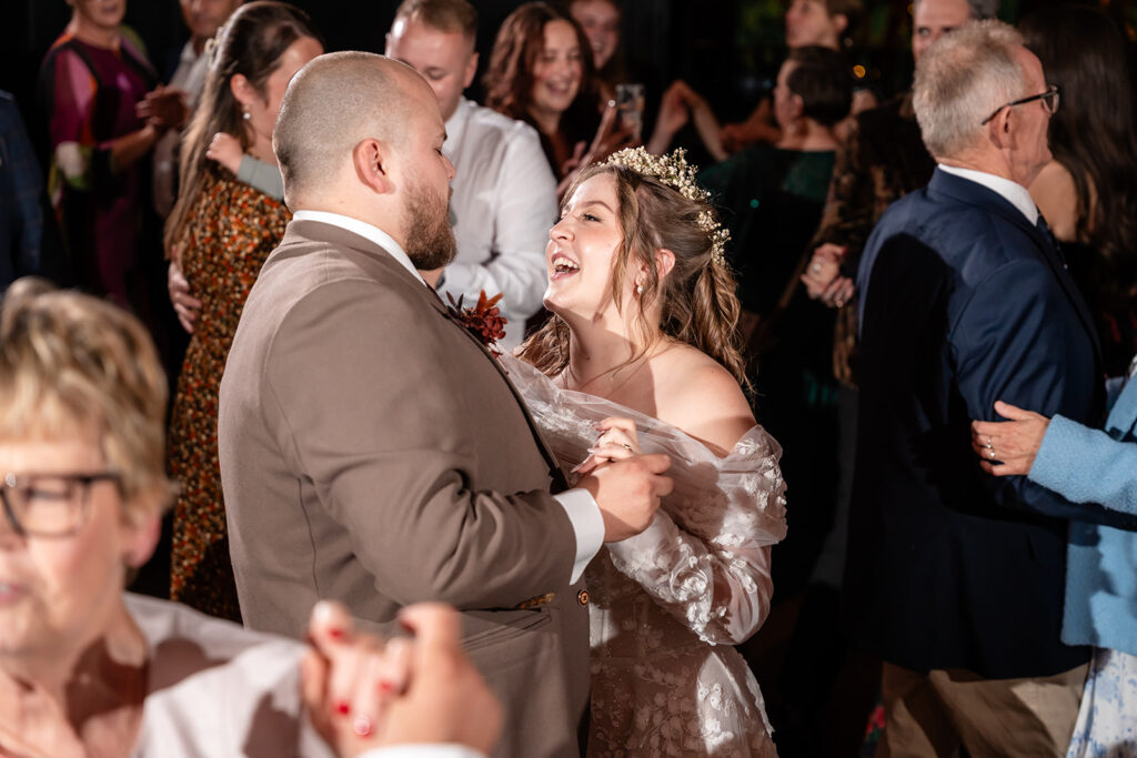 Rachel and Connor dancing with their guests at their wedding