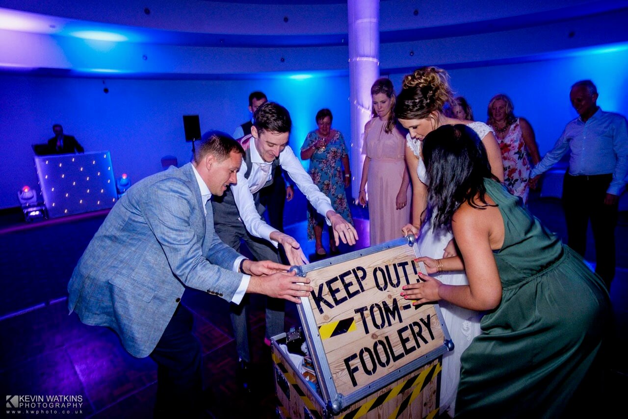Jonny, Rachel and the guests opening the tomfoolery box