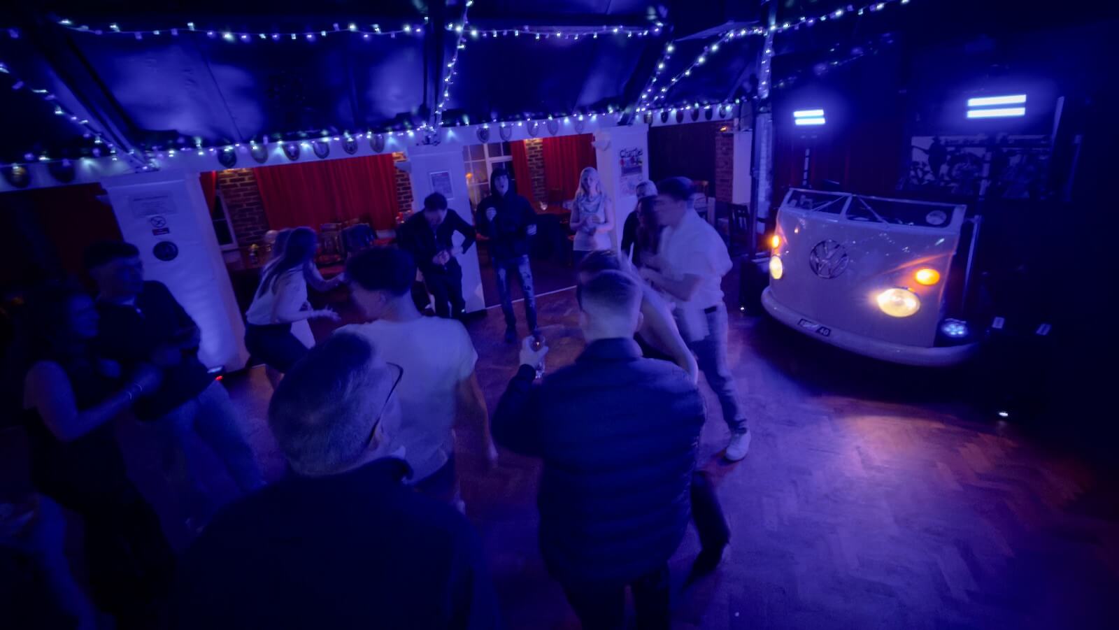 Everyone dancing at Robin's 40th birthday party at Limpsfield Royal British Legion Club with DJ Brian Mole and the awesome VW DJ booth