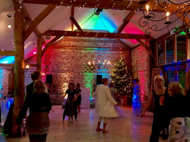 Upwaltham Barns with DJ Brian Mole, and uplighting looking fabulous with a Xmas tree too!