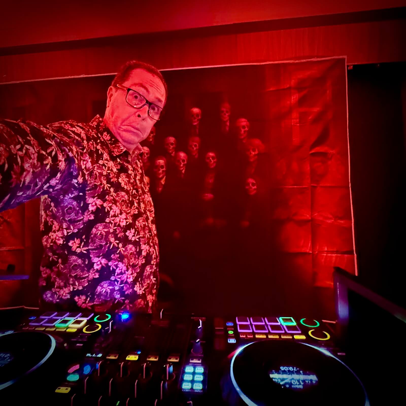 spooky backdrop behing dj brian mole at the worth hotel during a halloween themed wedding