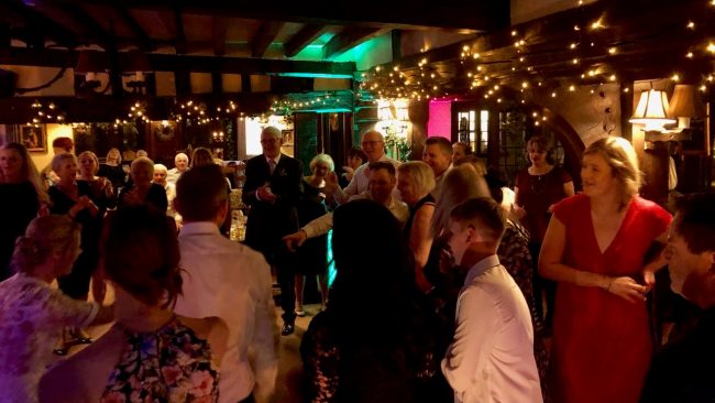 Sarah and James dancing with their fab guests at their wedding, The Crown Inn, Chiddingfold
