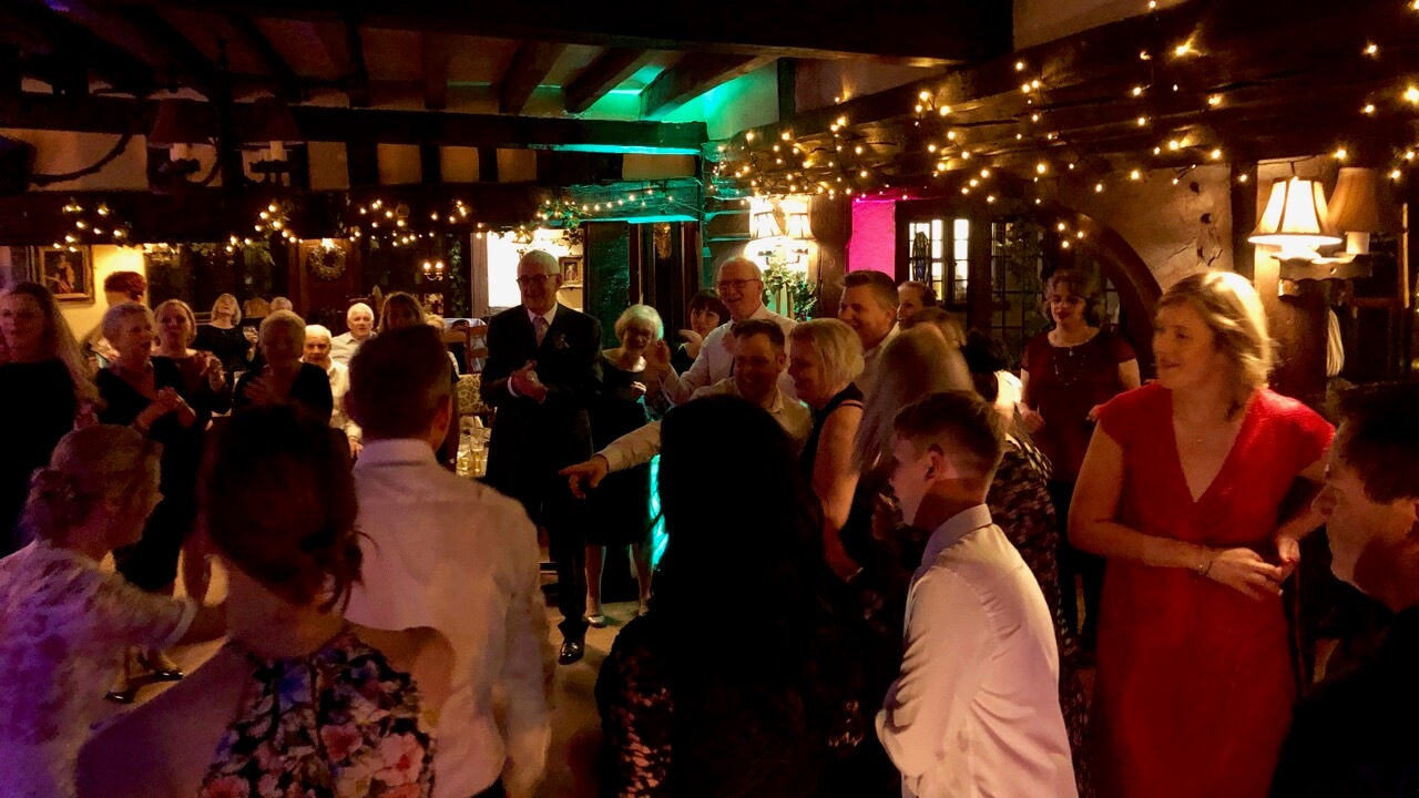 Sarah and James dancing with their fab guests at their wedding, The Crown Inn, Chiddingfold